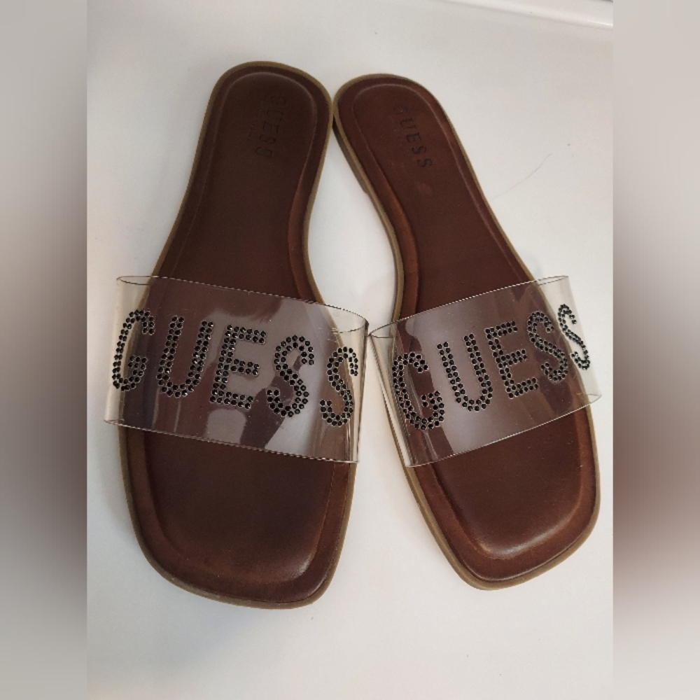Guess Sz 9 Clear and Cognac Sandals with Black rhinestone-embellished lettering.